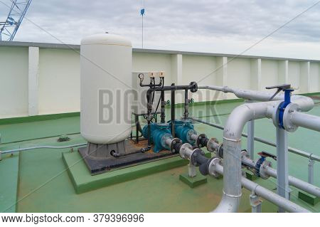 Chiller Tower Or Cooling Tower On Rooftop Of A Office Building. System Work. Architecture Machine. C