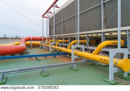 Chiller Tower Or Cooling Tower On Rooftop Of A Office Building. System Work. Architecture Machine. C