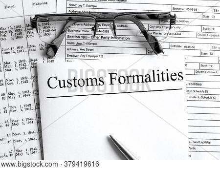 Paper With Text Customs Formalities On A Financial Tables With Glasses