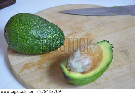 Natural Organic Ripe Avocado. Half Avocado On White Background. Isolated. Top View.