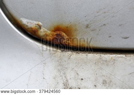 Close Up Corrosion, Old Rusty Stain On Hood Car. Damage To Protective Coating Metals. Car Service. C