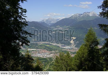 View Of Breno, Brescia, Lombardy, Italy, From The Road To Crocedomini Pass At Summer. Mountain Lands