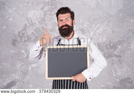 Man Good Looking Hospitable Restaurant Waiter With Blackboard Copy Space, Best Choice Concept.