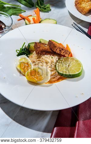 Thai Vegetarian Red Curry Rice Noodle Soup With Crispy Fried Tofu And Soft Boiled Egg