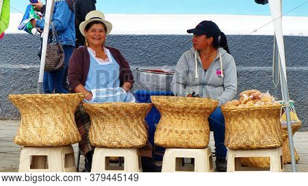 Cuenca, Ecuador - September 23, 2018: Street Market In Cuenca. Local Women With A Big Baskets Sell S