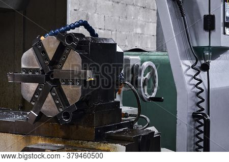 Industrial Background - Detail Of Machine Tool, Lathe Spindle Chuck With Six Jaws On The Tailstock