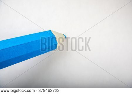 Blue Pencil Stands On A White Background
