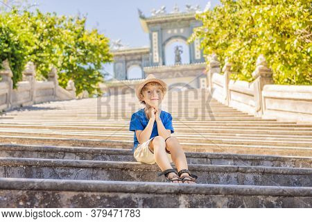 Boy Tourist In Chua Linh Ung Bai But Temple, Lady Buddha Temple In Da Nang, Vietnam. Traveling With 