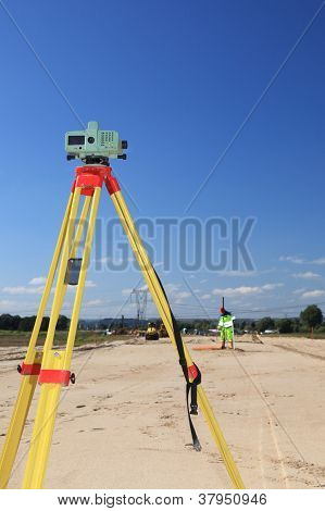 Geodesist Taking Measurement