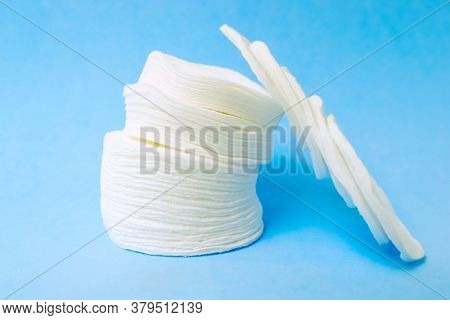 Cotton Cotton Cotton Discs On A Blue Background. Cosmetology And Medicine. Taking Care Of Yourself.
