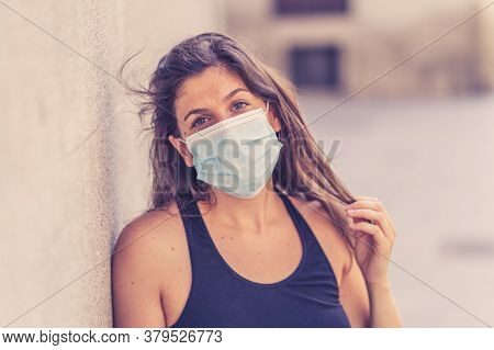 Young Woman Wearing Surgical Mask On Face In Public Spaces. Coronavirus Spreading Protection Mask Pr