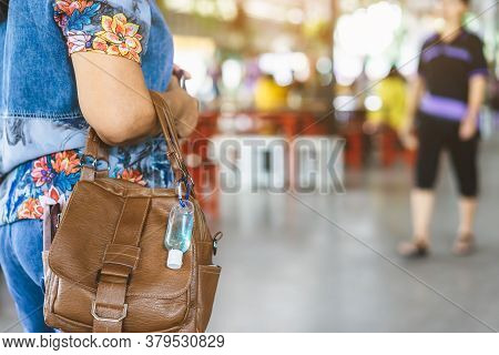 Mini Portable Alcohol Gel Bottle To Kill Corona Virus(covid-19) Hang On A Leather Shoulder Bag Of A 