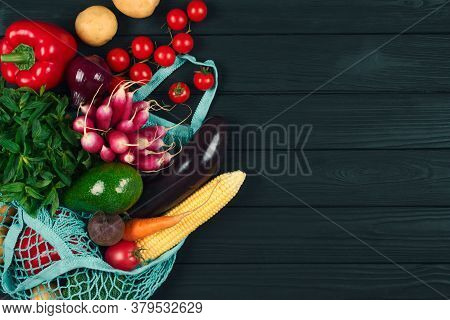 Cotton Bag Full Of Fresh Farm Raw Vegetables From Local Farmer Market, On Black Wooden Background Or