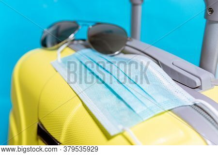 Pack Your Suitcase. Vacation Travel Trip In New Normal Concept, Antiseptic Gel Or Hand Sanitizer To 
