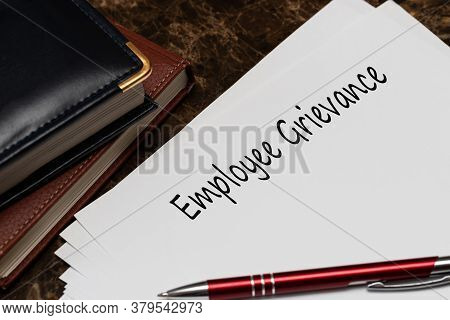 Employee Grievance Write On A Paperwork On Office Desk