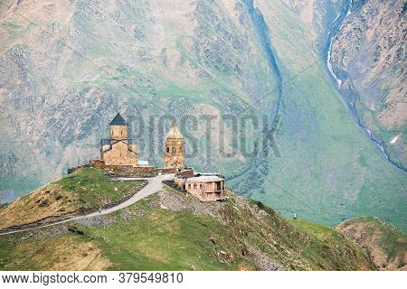 Stephantsminda, Georgia. Gergeti Trinity Church Or Tsminda Sameba - Holy Trinity Church Near Village