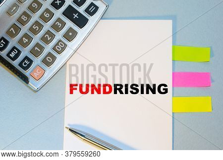 Business Concept - Top View Notebook Writing Fundrising