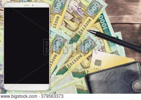1000 Sri Lankan Rupees Bills And Smartphone With Purse And Credit Card. E-payments Or E-commerce Con