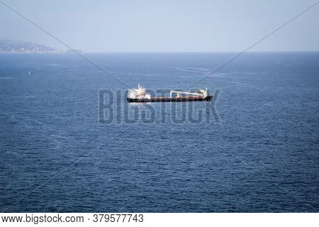 A Ship Or A Special Ship Lies In The Roadstead In Front Of The Port.