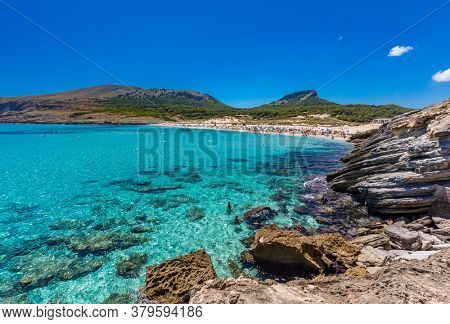 CALA MESQUIDA, MALLORCA, SPAIN - 19 July 2020: People enjoying beautiful sandy beach of on Mallorca, Mediterranean Sea, Balearic islands, Spain.