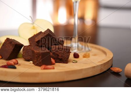 Delicious Brunost Cheese And Nuts On Table, Closeup
