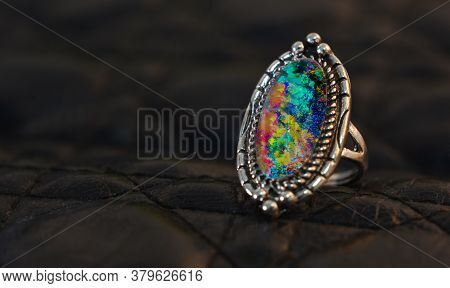 Opal Is A Silver Ring Decorated With An Opal Gem.