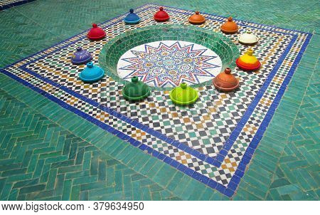 Geometric Patterned Mosaic Tiled Floor  With Tagine Offerings In Casablanca, Morocco