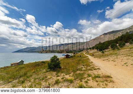 Sandy Path In Peschanaya Bay At Baikal Lake In Summer On A Sunny Day With Clouds
