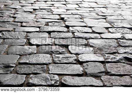 An Ancient Pavement Lined With Stone Paving Stones.