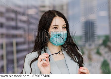 Woman In A Protective Face Mask At Public Place. Coronavirus, Covid-19 Spread Prevention Concept, Re