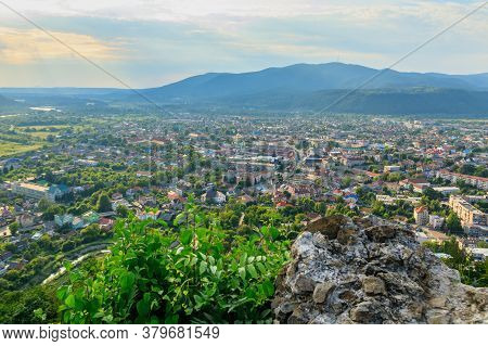 Ruins Of Old Hungarian Castle With A City View At Sunset, Khust, Western Ukraine.