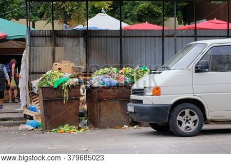 Dustbins Being Full With Various Garbage. Garbage Is Pile Lots Dump. Garbage Bins In City. Cardboard