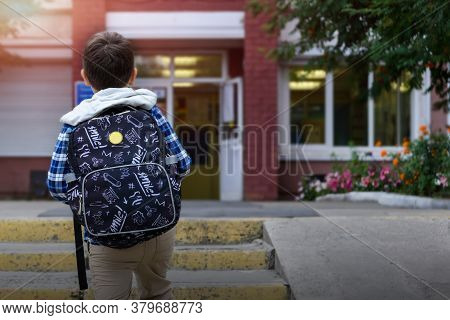 Child Boy With Bag Go To Elementary School. Back View