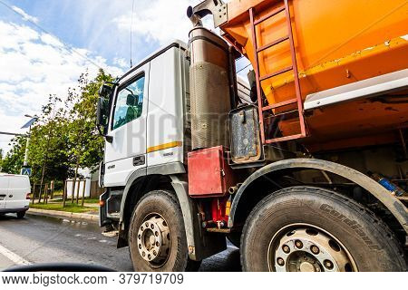 Traffic With Road View Through Car Front Window, Dirty Schmitz Cargobull Tipper Trailer Truck In Tra