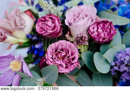 Close-up Bouquet Of Of Flowers On A Light Background. Bouquet Of Eucalyptus, Carnation, Hydrangea, R