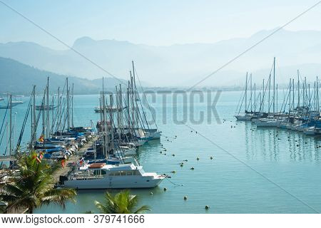 Boats At The Docks On A Sunny Day Preparing To Leave In The Ocean