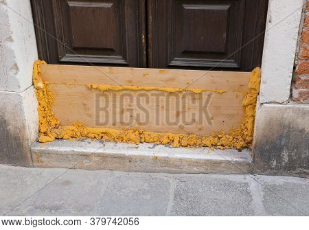 Wooden Bulkhead With Foam To Waterproof And Protect The Door During High Tide In Venice In Italy