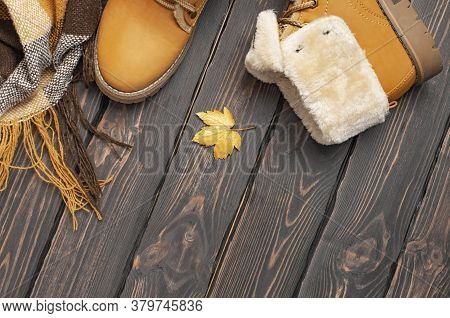 Autumn Fashion Concept. Brown Orange Leather Women Boots With Fur, Checkered Warm Plaid, Golden Autu
