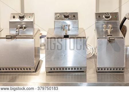 Commercial Deep Frier Machines In Restaurant Kitchen