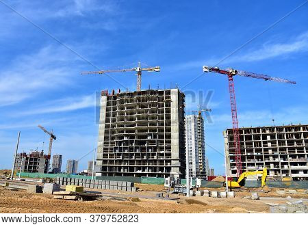 View On The Large Construction Site . Facde Of The Modern Multi-storey Residential Building. Use Of 