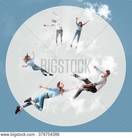Mid-air Beauty Cought In Clouds. Full Length Shot Of Attractive Young Woman And Man Hovering In Air 