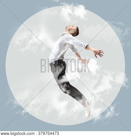 Mid-air Beauty Cought In Twilight. Full Length Shot Of Young Man Hovering In Air And Keeping Eyes Cl