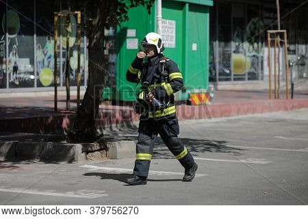 Bucharest, Romania - August 6, 2020: Firefighters Try To Extinguish A Fire That Spread Across An Apa