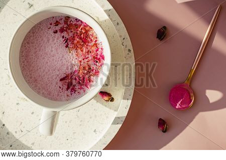 Cup Of Rose Cardamom Ayuverdic Drink On Pink Background.