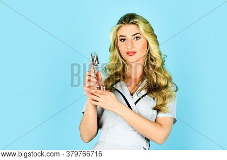 Beautiful Woman Holding Bottle Perfume Smelling Aroma. Attractive Girl Perfume Seller. Cosmetics Sho