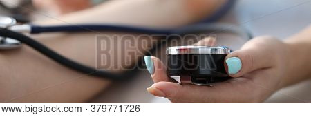 Female Hand Measures Pressure Patient In Clinic. Quality Treatment At Diagnostic Center. Consultatio