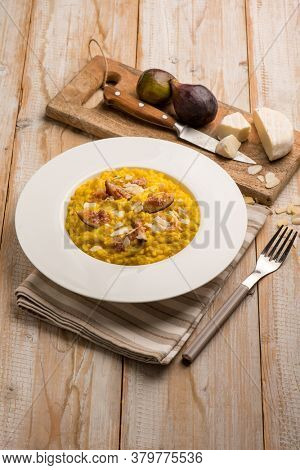 milanese risotto with cheese fig and sliced almond