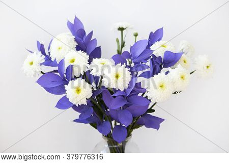 On A White Background Is A Bouquet Of White Chrysanthemums With Lilac Flowers Of The Decorative Plan