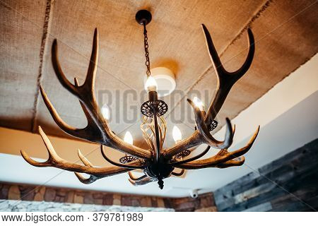 Chandelier Made Of Antlers, The Chalet-style Design Chandelier Interior Of The Cafe