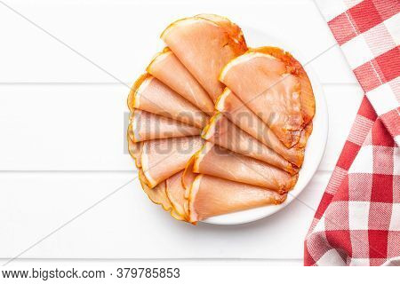 Dried spanish ham. Lomo embuchado on plate. Top view.